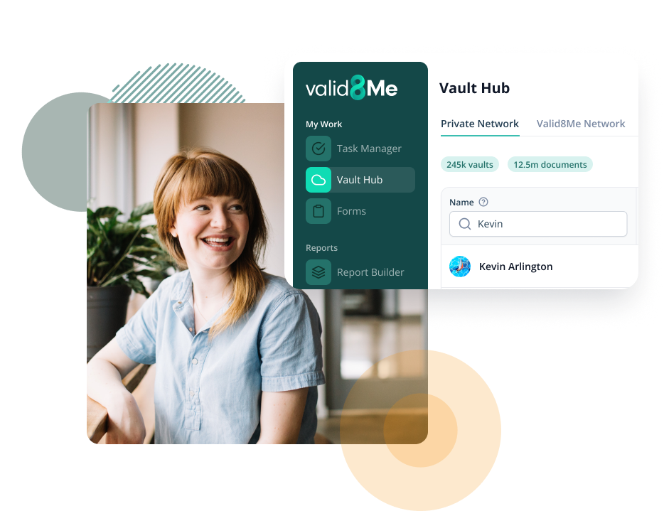 Two people looking at a phone in an office setting. 